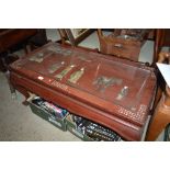 An oriental red lacquered low tea table decorated