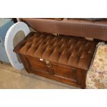 An oak and button down upholstered ottoman