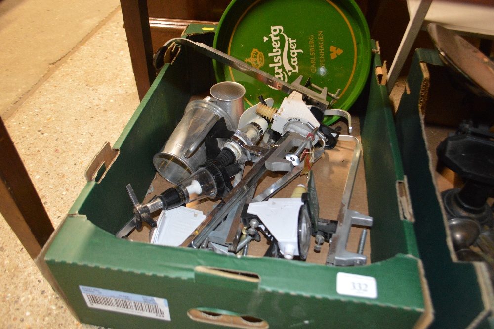 A box containing optics and pub memorabilia