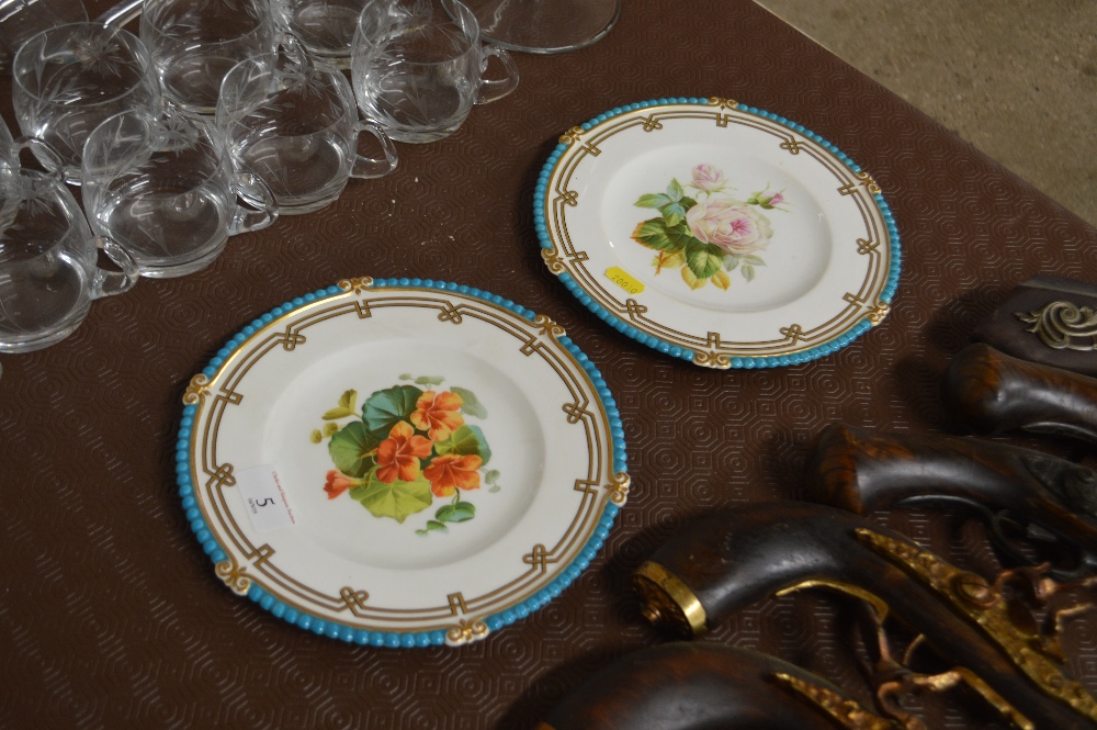 A pair of Minton floral decorated cabinet plates