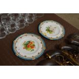 A pair of Minton floral decorated cabinet plates