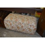 An upholstered ottoman