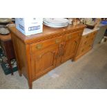 An early 20th Century golden oak sideboard fitted