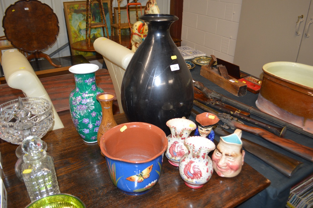 A quantity of various vases and jugs; and a jardin