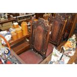 A set of four 1930's oak framed and leather uphols