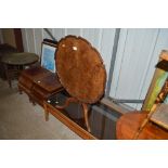 A walnut veneered tilt top occasional table