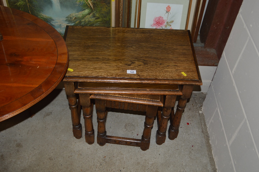 A nest of three oak occasional tables