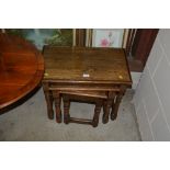 A nest of three oak occasional tables