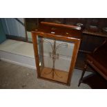 A walnut veneered display cabinet