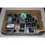 A box of various costume jewellery to include ear-