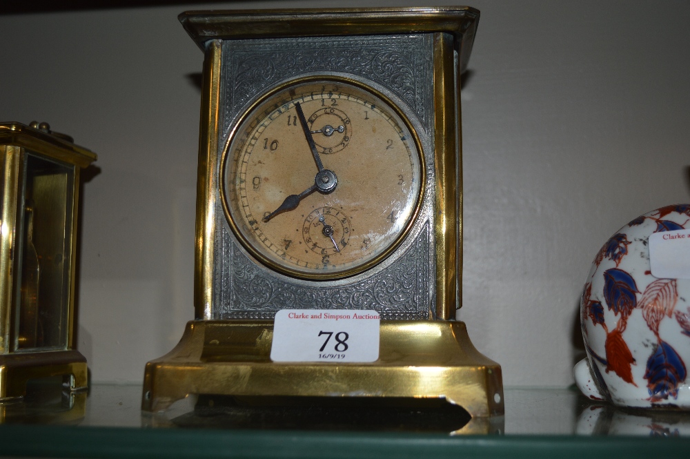 A brass cased clock