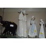 A Lladro figurine in the form of two nuns