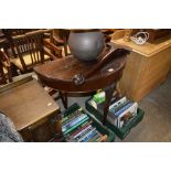 A Chippendale style mahogany fold over card table