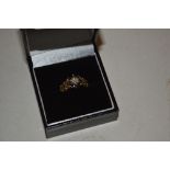 A 9ct gold sapphire and diamond set ring of flower