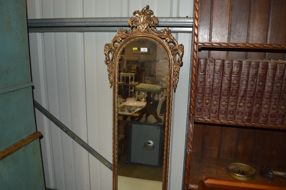 A gilt framed oblong mirror