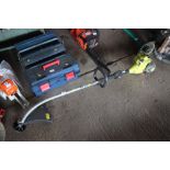 A Ryobi petrol powered strimmer