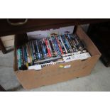 A box of various DVDs
