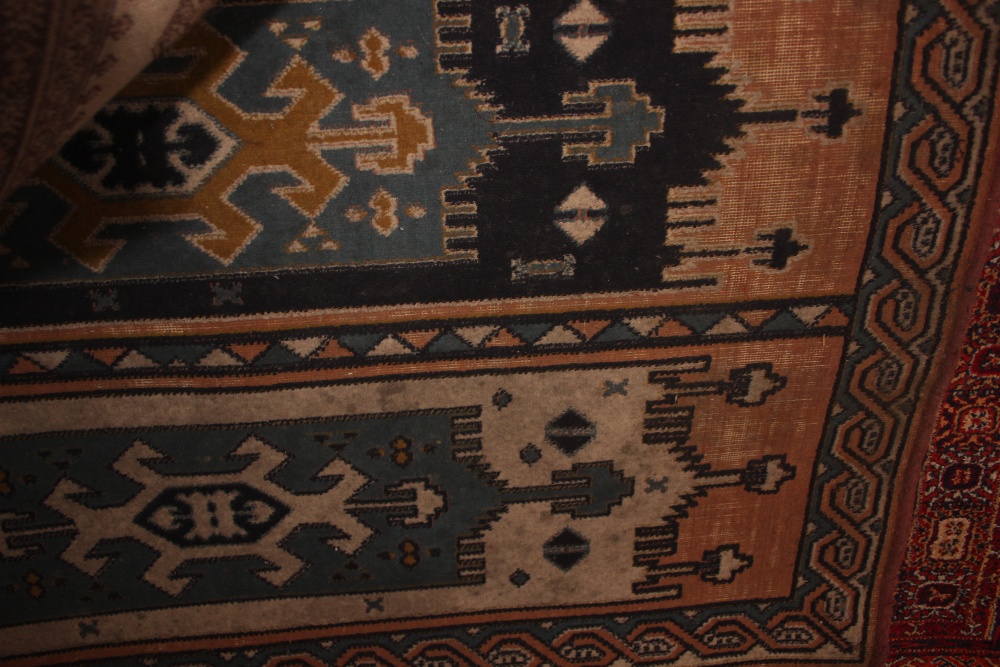 An approximate 7'3" x 5'2" wool patterned rug