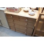 A stripped pine chest fitted two short over three