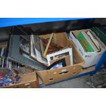 A box of various pictures; prints and frames