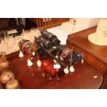 A horse and carriage ornament; a shire horse ornament and o