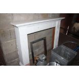 A white painted fire surround