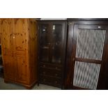 A display cabinet fitted three drawers below