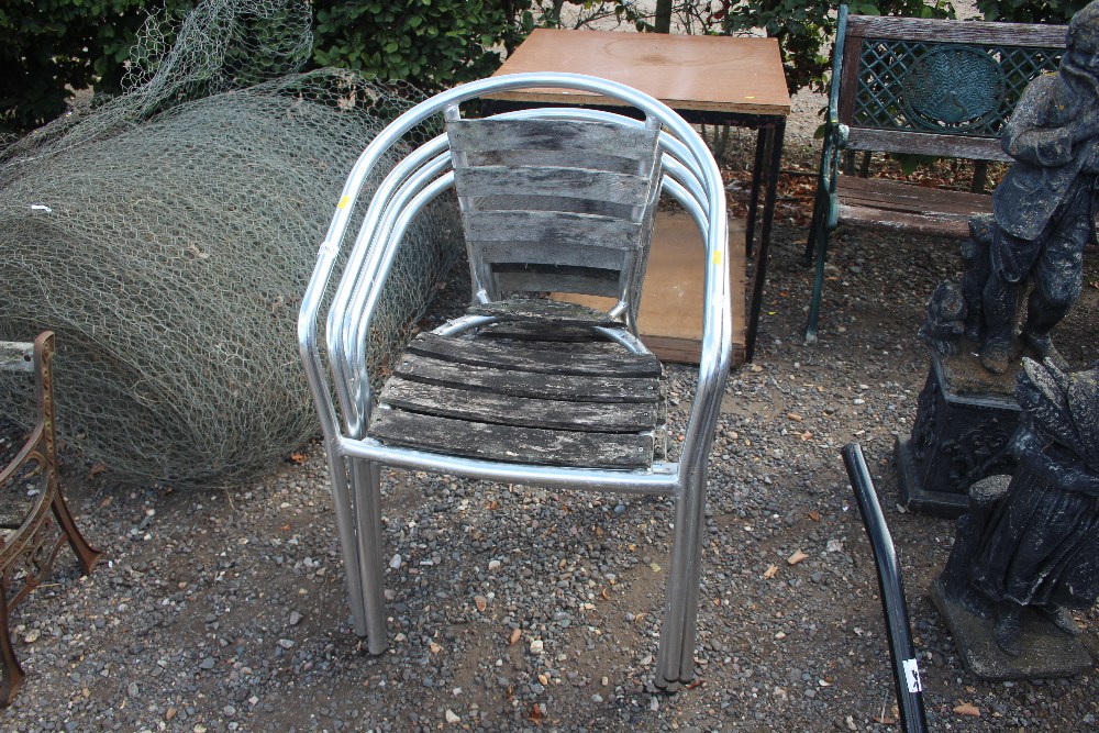 A set of four wooden and metal garden chairs