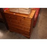 A modern pine chest fitted two short over three lo