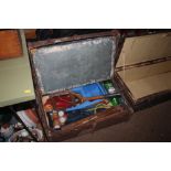 A wooden bound travelling trunk and contents of va