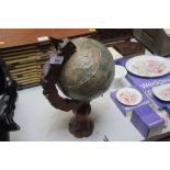 A globe on wooden stand