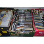 A box of various CDs