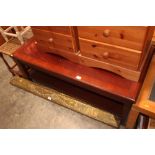 A reproduction mahogany two tier coffee table