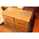 A pair of pine effect three drawer bedside chests