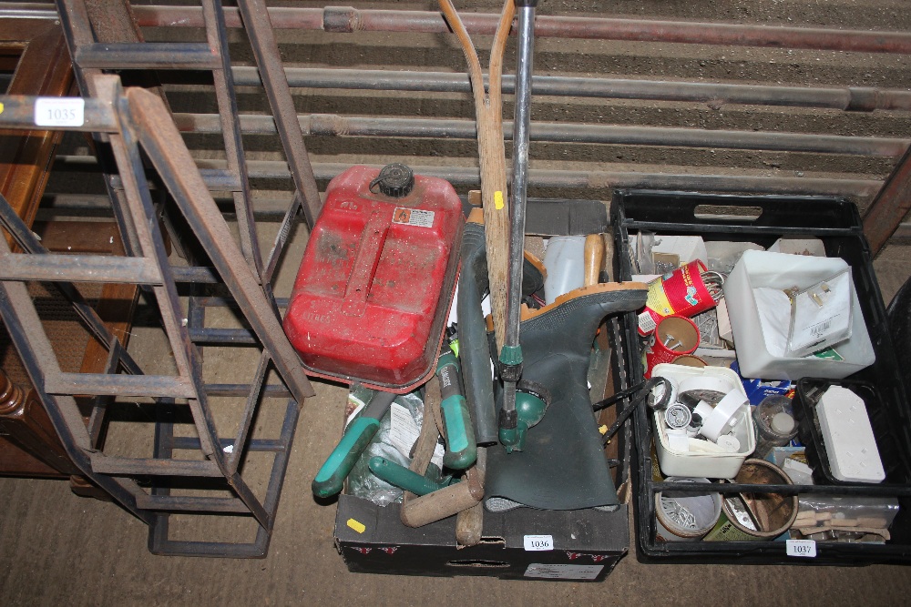 A box containing various gardening tools; a petrol