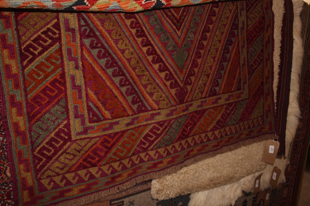 An approximate 4'2" x 3'9" Gazak rug