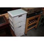 A white painted chest fitted five drawers