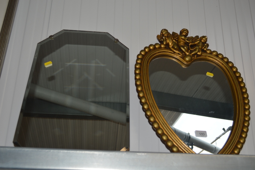 A bevel edged wall mirror; together with a heart s