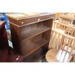 A reproduction mahogany open fronted bookcase