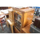 An oak and glazed cabinet