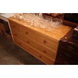 A pine effect multi drawer chest