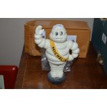 A reproduction money box in the form of a Michelin