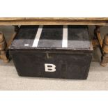 A large black canvas and metal bound travelling trunk, initialled with a "B", 83cm wide