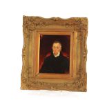 English school, early 19th Century portrait of a seated gentleman, oil on board, 16cmx 13cm