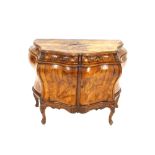 A 19th Century Italian walnut bombe shaped commode / cabinet, the serpentine top above two short