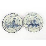 A pair of Pearlware plates, decorated in the Chinese manner with figures holding parasols, 24.5cm