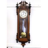 A Victorian walnut cased regulator type wall clock, having circular brass mounted Roman numeral