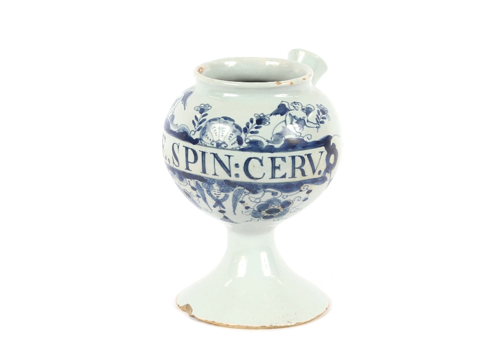 An 18th Century Delft wet drug jar, inscribed S:E.,SPIN:CERV.  having blue floral and cherub