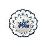 An English porcelain blue and white fruit basket, having floral decoration, 15cm dia.; and a small