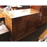 An Antique French elm buffet cupboard, fitted with a single frieze drawer, shelves below enclosed by